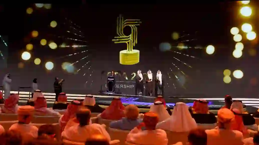 An aerial view of a river surrounded by lush green trees.